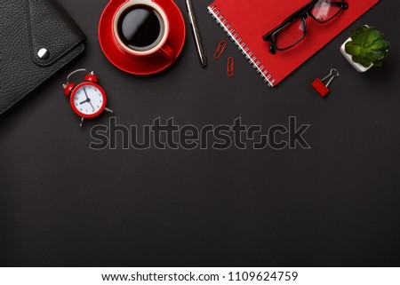 black background red coffee cup note pad alarm clock flower diary scores keyboard