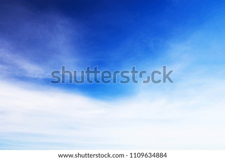 Blue sky background and white clouds soft focus, and copy space.