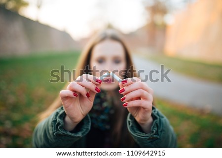 Quit Smoking. Closeup Of Beautiful Girl Holding Broken Cigarette In Hands. Portrait Of Smiling Young Woman Breaking Cigarette In Half, Quitting To Smoke Cigarettes.