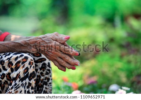 Wrinkled hands of an old woman. selective focus