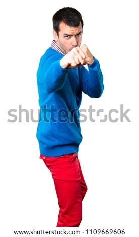 Handsome young man fighting on white background
