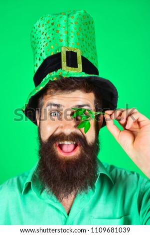 Saint Patrick's Day. Happy four leafed clover. Green hat with clover. Saint Patrick's Day symbols. Bearded man in green men hats celebrate Patricks Day. Patricks Day green shamrock. Ireland tradition.