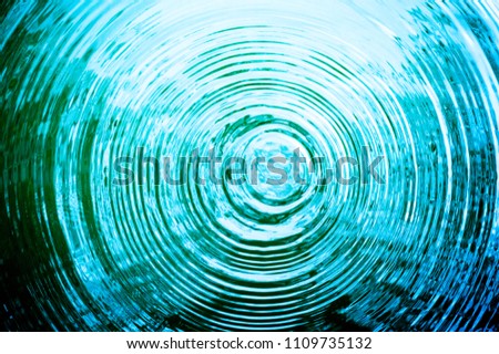 Top view Closeup blue water rings, Circle reflections in pool. Royalty-Free Stock Photo #1109735132