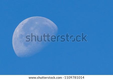 A close-up shot of the moon in the morning