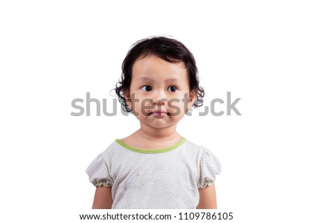Picture of adorable little girl standing in the studio, isolated on white background