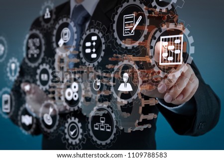 AR virtual screen dashboard with project management with icons of scheduling, budgeting, communication.businessman hand show gear to success as concept