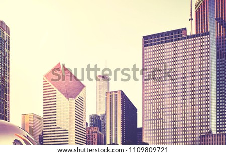 Retro stylized picture of Chicago skyline at sunset, USA.