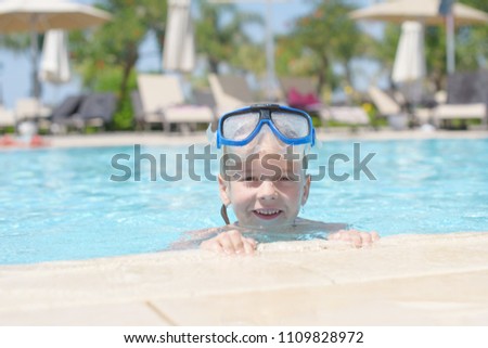 cute little boy having fun in the pool