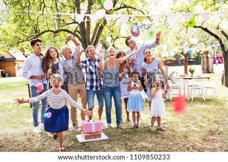Family celebration or a garden party outside in the backyard.