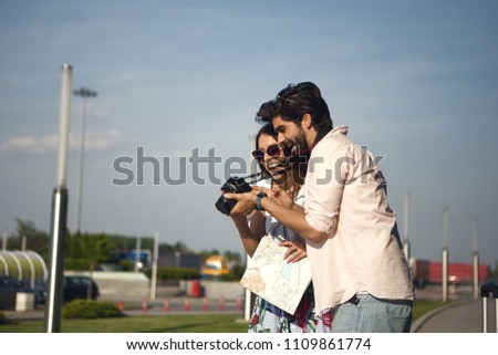 The handsome young man with a beard, showed photographs of a beautiful girl, she was thrilled.