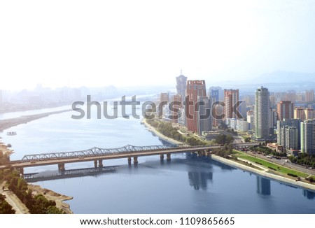 Aerial view of new residential complex and Daedong River (Taedong River), Pyongyang - capital city of North Korea (DPRK). View from Yanggakdo island Royalty-Free Stock Photo #1109865665