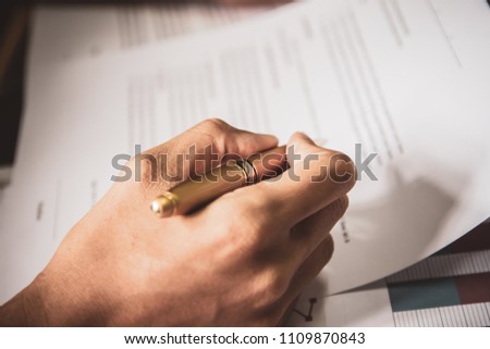 businessman or lawyers sitting office signing contract papers on wood table. Law of advisor Concepts and vintage, Sunset light.Selective Focus