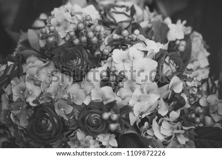 flower composition. Closeup of beautiful fresh colorful summer bunch of cut flowers with red roses voilet and blue hydrangea and green buds, horizontal picture