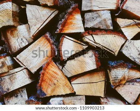 Firewood background, wall firewood, background of dry chopped firewood logs in a pile Royalty-Free Stock Photo #1109903213