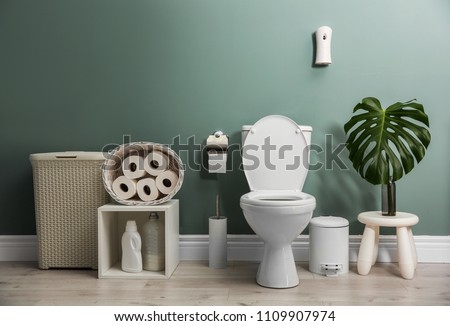 Bathroom interior with new ceramic toilet bowl Royalty-Free Stock Photo #1109907974