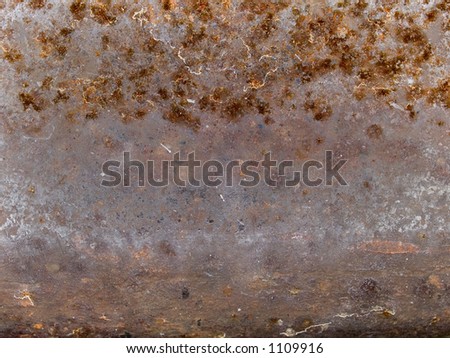 Stock macro photo of the texture of rusty, grungy metal.  Useful for layer masks or abstract backgrounds.