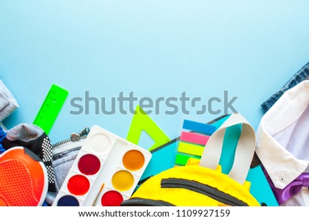 stationery flat lay on blue background