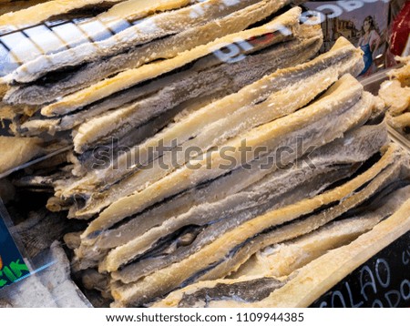 counter at the central market of Valencia with dried cod, Spain