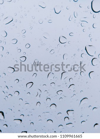 Rain drops on windshield glass