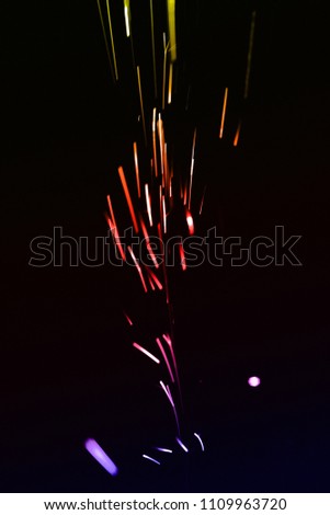 Flame of fire with sparks on a black background
