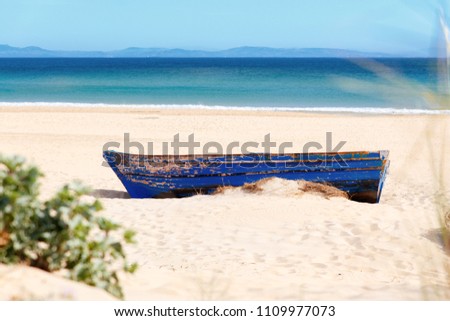 Wooden boat on the ocean shore