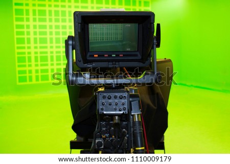 LCD display screen on a High Definition TV camera in a green screen studio.
