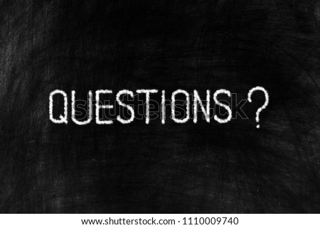 Questions in Chalk Writing on Old Grunge Chalkboard Background, Suitable for Education and Business Concept.