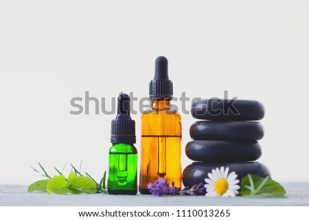 aromatherapy oil with fresh herbs and flowers - alternative medicine