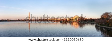 Jefferson Memorial and Washington Monument reflected on Tidal Basin in the evening, Washington DC, USA. Panoramic image