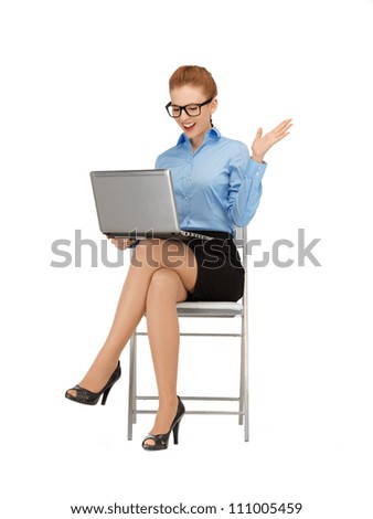 picture of woman with laptop computer in specs