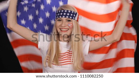 Attractive Happy American Supporter Woman Smiling for Success of her Football Team or Goal or Winning Celebration in Sport Event Competition, Celebrating 4th of July American Independence Day