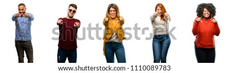 Group of cool people, woman and man pointing to the front with finger