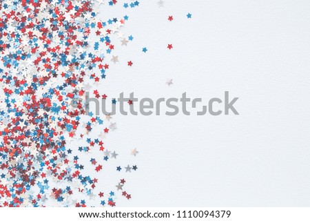 4th of July American Independence Day decorations on pastel blue background. Flat lay, top view, copy space Royalty-Free Stock Photo #1110094379