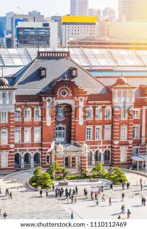 Asia Business concept for real estate and corporate construction - panoramic view of modern city skyline and tokyo station under clear sky in tokyo, japan (Translation of stele : tokyo station)