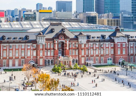 Asia Business concept for real estate and corporate construction - panoramic view of modern city skyline and tokyo station under clear sky in tokyo, japan (Translation of stele : tokyo station)