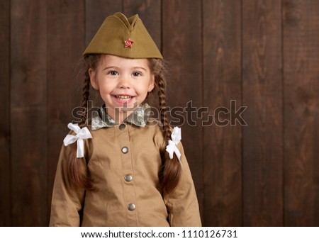child girl are dressed as soldier in retro military uniforms