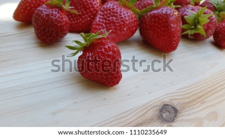 Strawberry. Strawberries on light wood