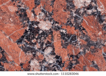 Granite texture. Reddish-brown base with black and gray spots. Used as a background.