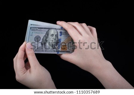 Hand holding American dollar  banknotes isolated on white background