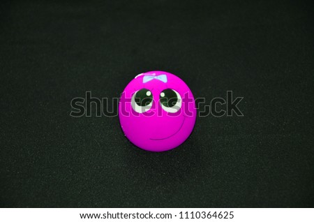 smiley pink purple funny on black background candle smiley
