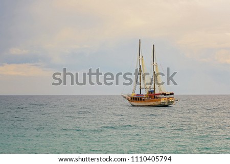 old ship in the blue sea
