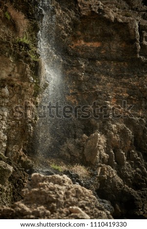 Artificial waterfall in Anchor Bay Malta