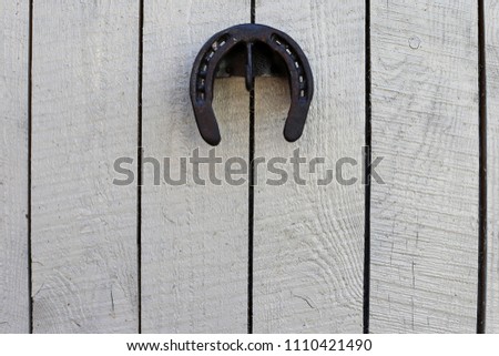 The horseshoe hangs on the wall of the stables for good luck.