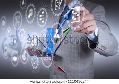 AR virtual screen dashboard with project management with icons of scheduling, budgeting, communication.businessman hand drawing a pie chart and 3d graph