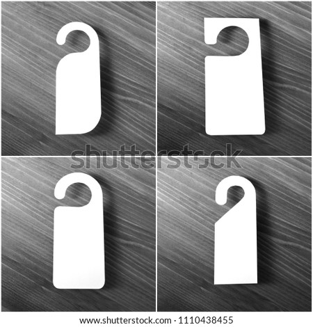 Set of blank door hanger on a wooden background