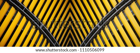 Collage photo on the subject of modern architecture made of yellow shutters / jalousie / louvers. Royalty-Free Stock Photo #1110506099