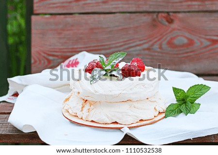 meringue pie with strawberries on a towel, on a substrate