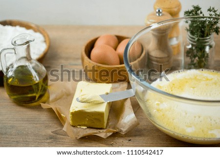 Cooking ingredients and spices for home food recipe preparation on table wooden background.