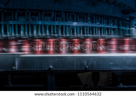 soda cans to pass with speed on the factory line. Royalty-Free Stock Photo #1110564632