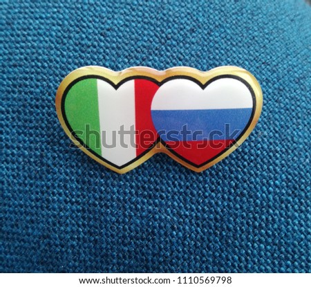 forever in love Italy and Russia. Two hears with national russian and italian colors on classic blue background. Free copy space. Concept of friendship, help and care. Difficult moment.
